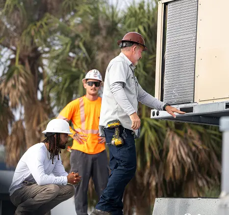 Mid-State crew in hard hats and high-visibility vests on a job site