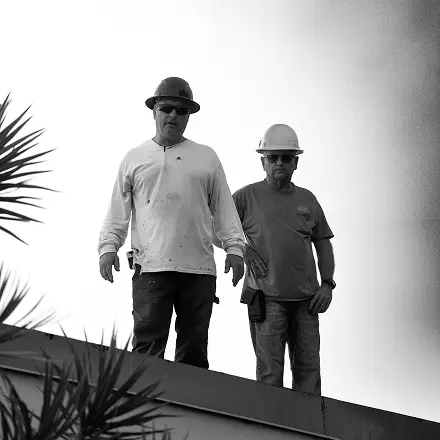 Two Mid-State team members walking on site