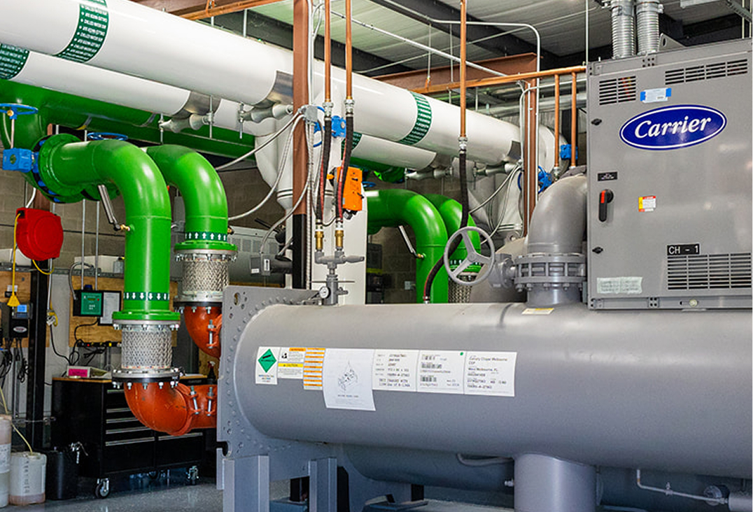 Mid-State Mechanical technician performing preventative maintenance on HVAC equipment