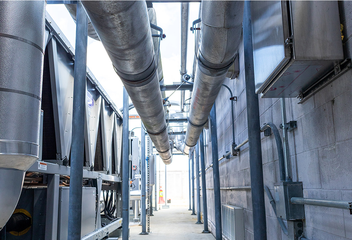Mid-State Mechanical service team working on HVAC equipment