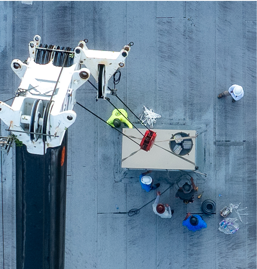 Mid-State Mechanical technician performing preventative maintenance on HVAC equipment