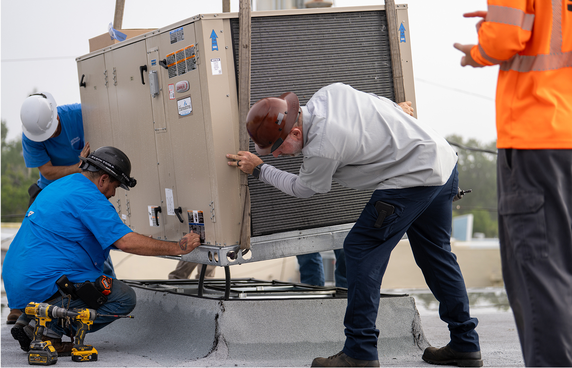 Mid-State Mechanical service team working on HVAC equipment