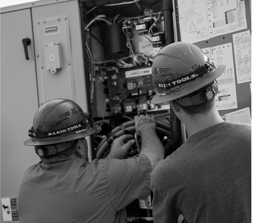 Mid-State Mechanical technician performing preventative maintenance on HVAC equipment