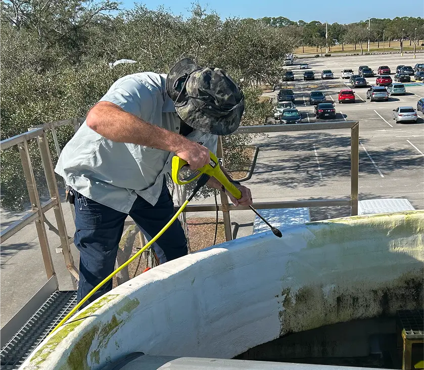 Mid-State Mechanical technician performing preventative maintenance on HVAC equipment